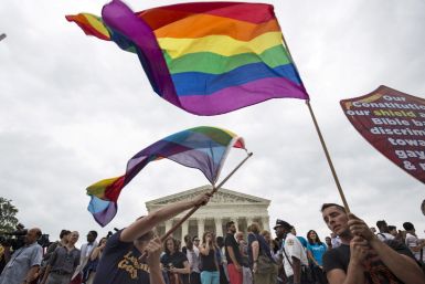Supporters of gay marriage wave the rainbow flag after the U.S. Supreme Court ruled on Friday that the U.S. Constitution provides same-sex couples the right to marry