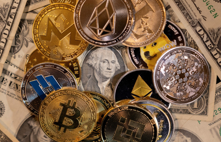 Illustration shows representations of virtual cryptocurrencies on U.S. dollar banknotes