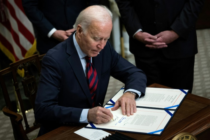US President Joe Biden signs a resolution to avert a nationwide rail shutdown