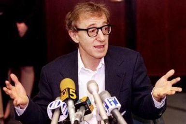 Film director Woody Allen reacts during a press conference in New York June 7, after estranged lover actress Mia Farrow was awarded custody of their three children.