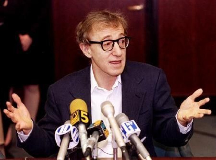 Film director Woody Allen reacts during a press conference in New York June 7, after estranged lover actress Mia Farrow was awarded custody of their three children.
