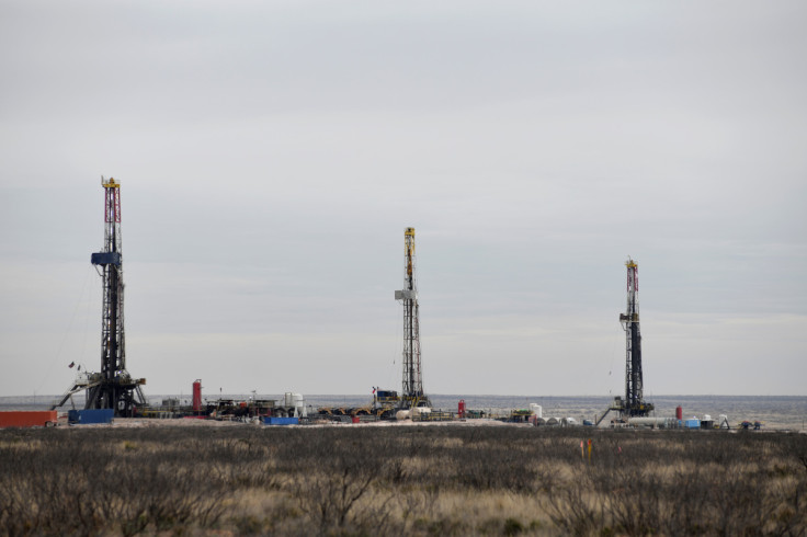 Drilling rigs operate in the Permian Basin oil and natural gas production area in Lea County