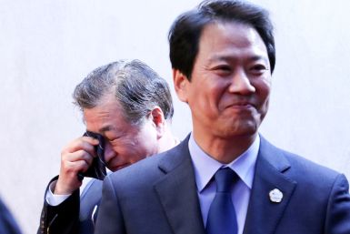 Suh-hoon, South Korea's chief of the National Intelligence Service (NIS) cries after delivering a joint statement, next to Im Jong-seok, South Korea's chief presidential secretary, at the truce village of Panmunjom