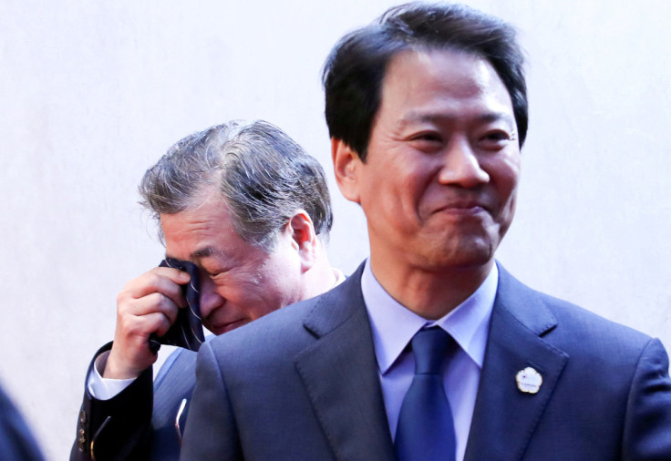 Suh-hoon, South Korea's chief of the National Intelligence Service (NIS) cries after delivering a joint statement, next to Im Jong-seok, South Korea's chief presidential secretary, at the truce village of Panmunjom