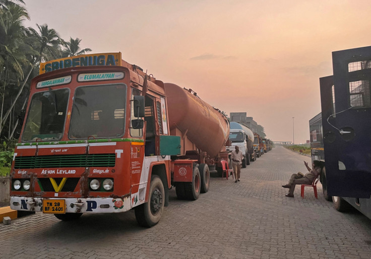 Supply trucks carrying construction materials for the proposed Vizhinjam Port are parked near the port