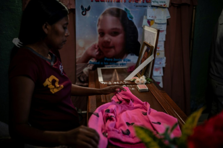 Yadimar Sierra, aged 11, was sleeping when a bullet fired through a window struck her in the head; relatives blame the police and are demanding justice