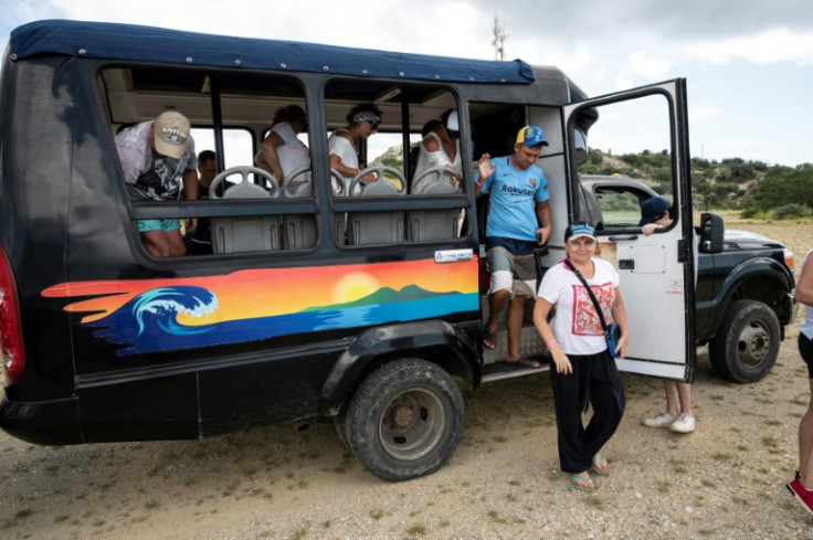 Russian tourists on a Venezuelan island are accompanied everywhere by a guide and a translator
