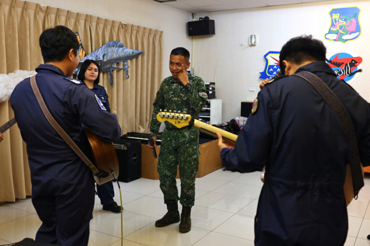 Hsu Shao-qiang, 29, makes eye contact with band member during practice at Chihhang Air Base in Taitung