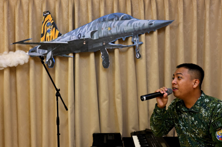 Hsu Shao-qiang, 29, sings during band practice at Chihhang Air Base in Taitung