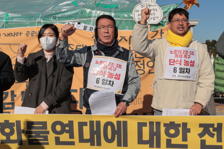 Protesters chant slogans at a news conference in support of the ongoing strike by truckers in Seoul