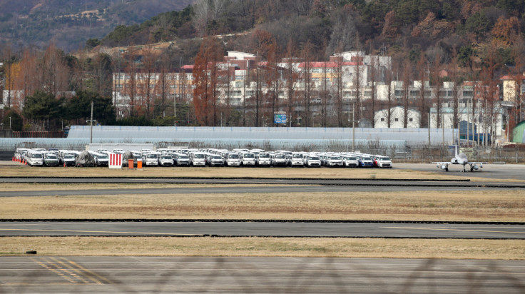 Finished vehicles are parked and wait to be delivered at an airport due to the nationwide strike by truckers in Gwangju