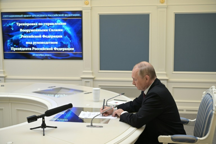 There are fears Russian President Vladimir Putin, pictured overseeing training of strategic deterrence forces, might yet resort to a nuclear strike