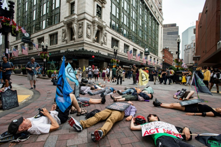 Activists of Extinction Rebellion hold a 'die-in' for climate action in Boston in July 2022