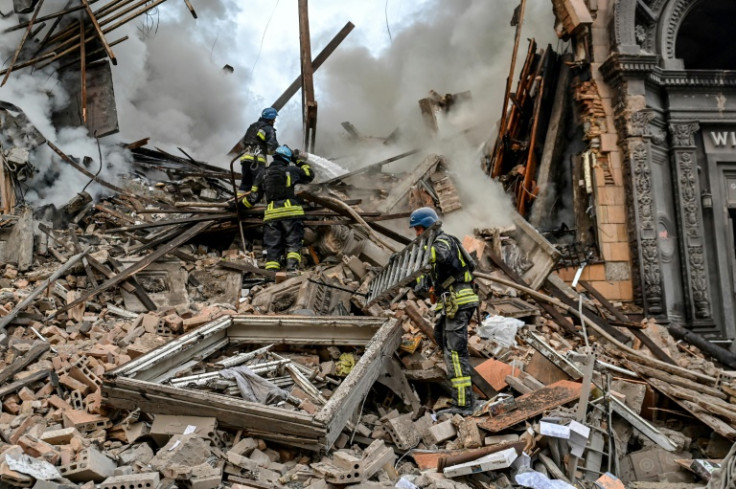 Ukrainian firefighters push out a fire after a strike in Zaporizhzhia, home of Europe's largest nuclear power plant, in October 2022