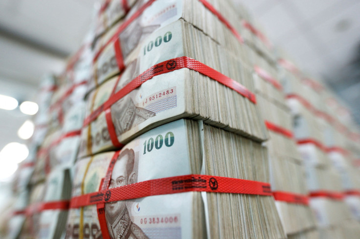 Thai baht notes are seen at a Kasikornbank in Bangkok