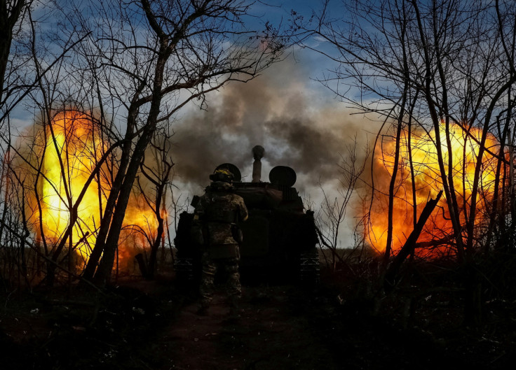 Ukrainian servicemen fire a self-propelled howitzer toward Russian positions on a frontline in Donetsk region