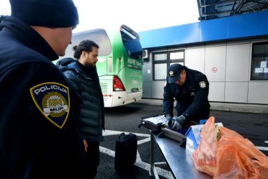 Croatian police officers check luggages at the border with Bosnia and Herzegovina in eastern Croatia