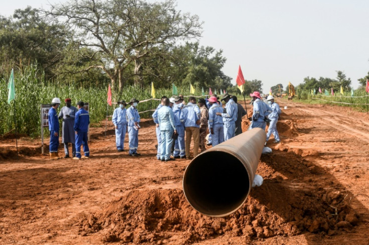 Chinese and Nigerien workers are building a huge pipeline that will take crude oil from Niger to a port in Benin