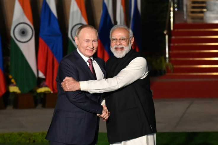 Indian Prime Minister Narendra Modi (R) greets Russian President Vladimir Putin before a late 2021 meeting in New Delhi