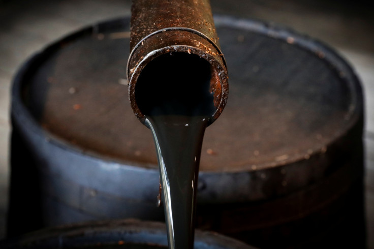 Oil pours out of a spout from Edwin Drake's original 1859 well that launched the modern petroleum industry at the Drake Well Museum and Park in Titusville, Pennsylvania