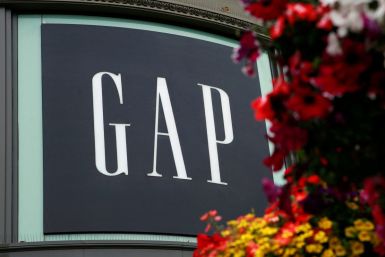 A basket of flowers hangs near Gap Inc's flagship retail store at the Powell Street cable car turn in San Francisco