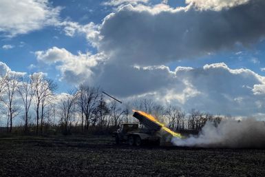 Ukrainian servicemen fire with a BM21 Grad multiple launch rocket system in a frontline on the border of Kharkiv and Luhansk regions
