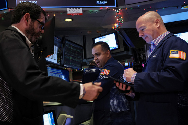 Traders work on the floor of the NYSE in New York