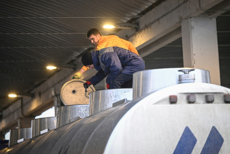 A Romanian border gard inspects a tanker at the border post in Giurgiu-Ruse, between Romania and Bulgaria, on December 6, 2022