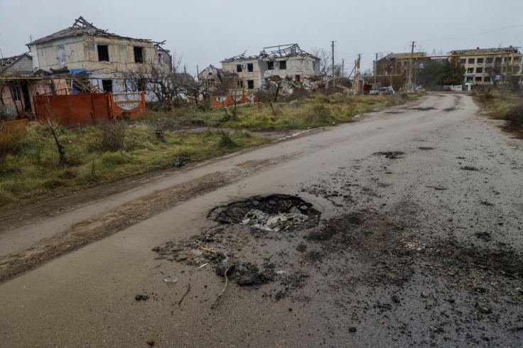 Destroyed buildings are seen in the village of Posad-Pokrovske