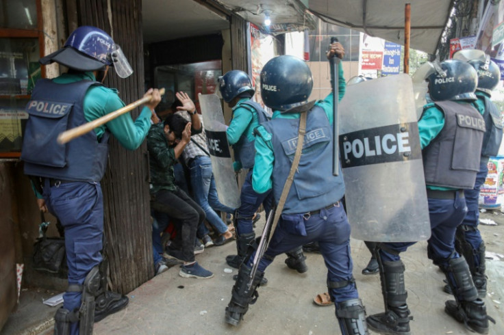 Police charge Bangladesh Nationalist Party (BNP) activists as they gather in front of the party's office in Dhaka on Wednesday