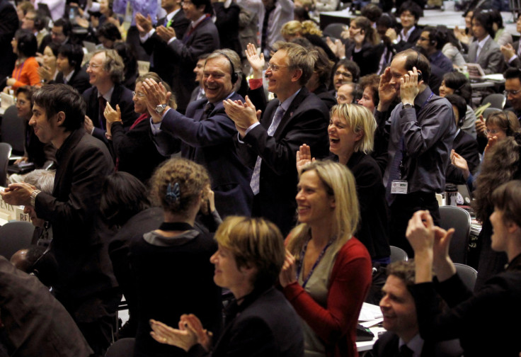 Delegates cheer after the Nagoya Protocol on genetic resources was agreed on at the 10th Conference of the Parties to the COP10 in Nagoya, central Japan