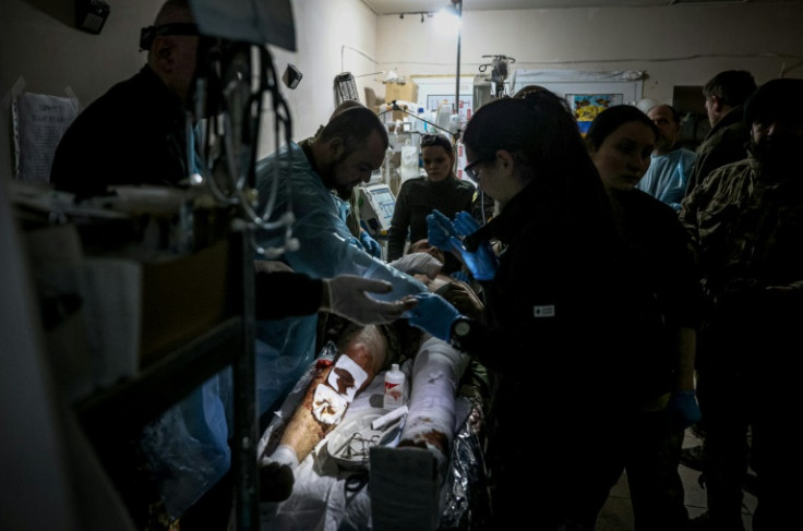 A wounded Ukrainian soldier receives treatment at a stabilising mobile hospital around Bakhmut