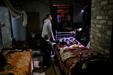 A family in a basement used as a bomb shelter in Bakhmut