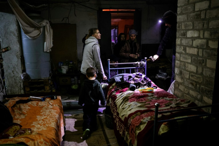 A family in a basement used as a bomb shelter in Bakhmut