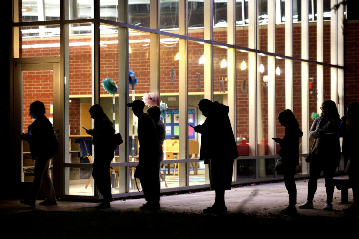 Voters line up a few minutes before the polls close in Durham, North Carolina