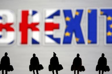 Small toy figures are seen in front of a Brexit logo in this illustration picture