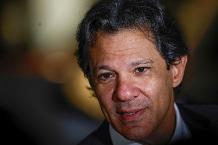 Former Mayor Fernando Haddad talks with journalists after attending a meeting at the transition government building in Brasilia