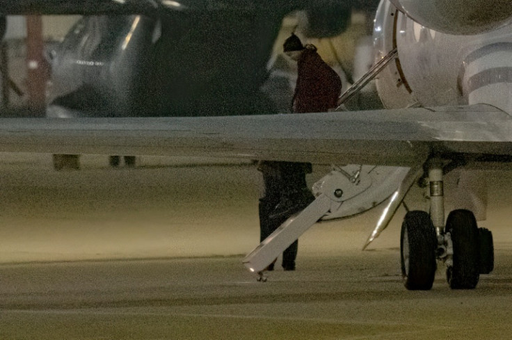 American basketball star Brittney Griner gets out of a plane at a military base in San Antonio after being released in a swap with Russia