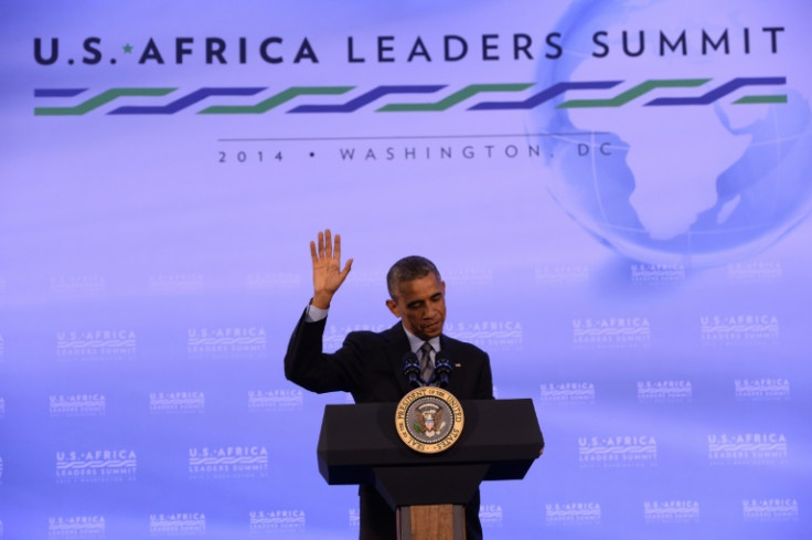 Then US President Barack Obama waves as he finishes a press conference at the end of the US-Africa Leaders Summit in Washington on August 6, 2014