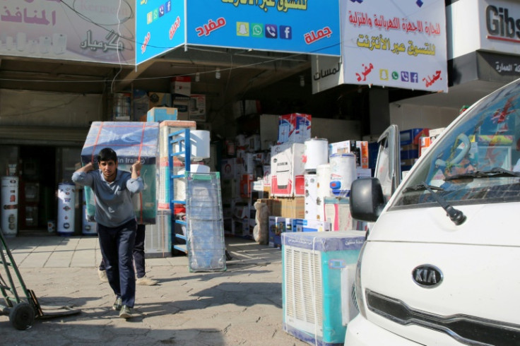 Air conditioners and electrical appliances imported from Iran are unloaded in Baghdad in February 2019