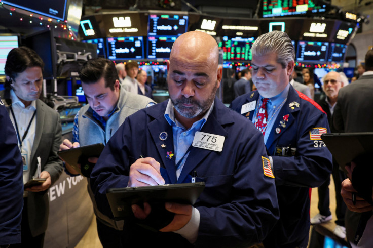 Traders work on the floor of the NYSE in New York