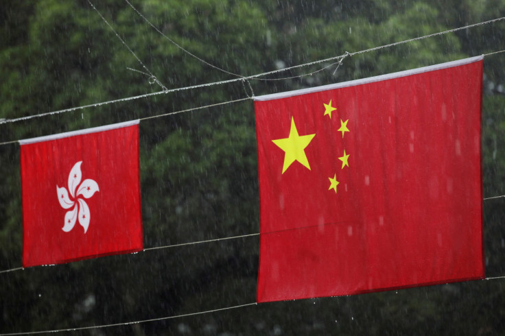 Chinese and Hong Kong flags decorate a street in Hong Kong