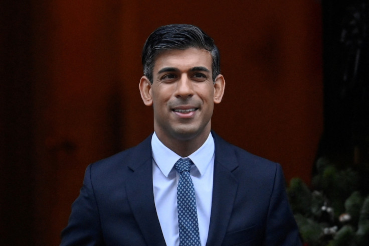 British Prime Minister Sunak walks outside Downing Street