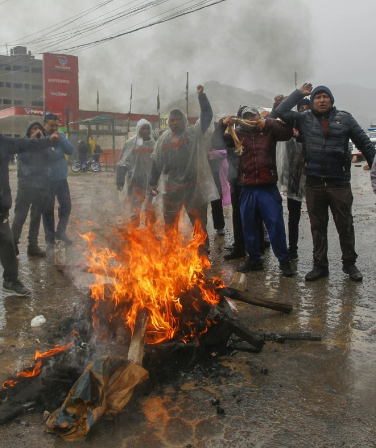 Supporters of former President Pedro Castillo block a road to Puno in Peru's high Andes on December 13, 2022