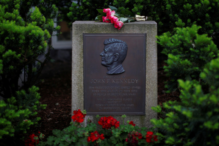 Roses lie on a marker outside the home where President John F. Kennedy was born 100 years ago on May 29, 1917, in Brookline
