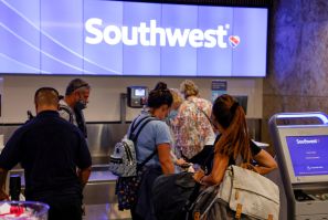 Passengers check in for a Southwest Airlines flight at Orlando International Airport in Orlando