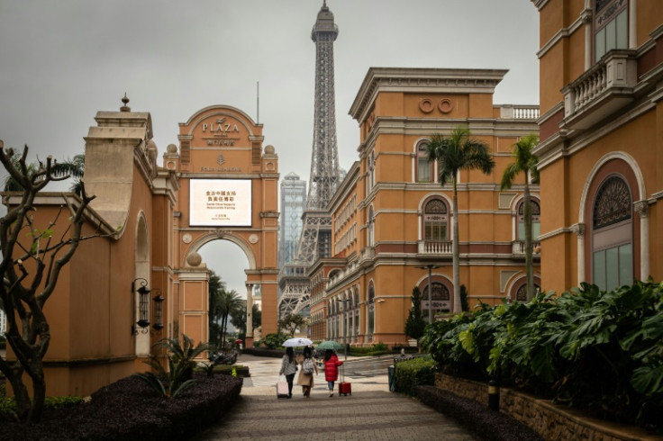 Visitors walk on the Cotai Strip, Macau's main gambling area, on Friday