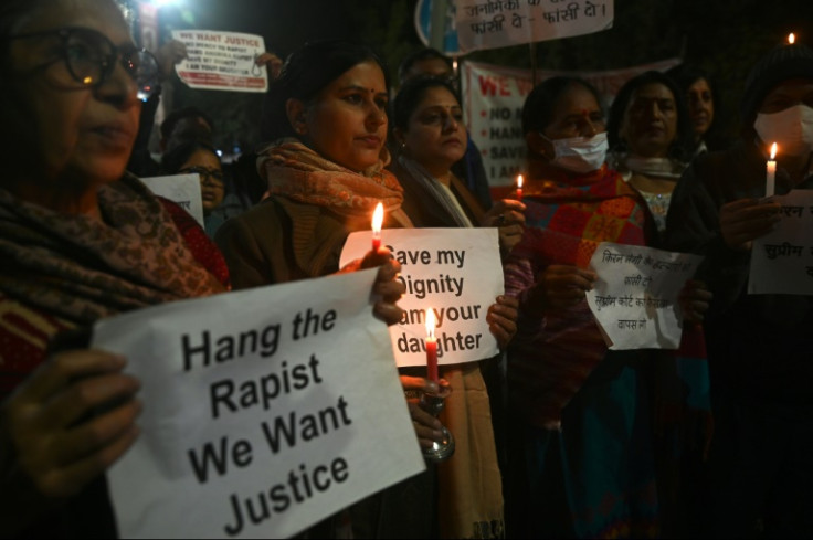 Activists and campaigners hold a candlelight vigil for Jyoti Singh, who was brutally gang-raped and murdered on a New Delhi bus 10 years ago