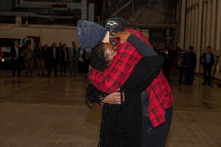 U.S. basketball star Griner embraces her wife after her release from Russia