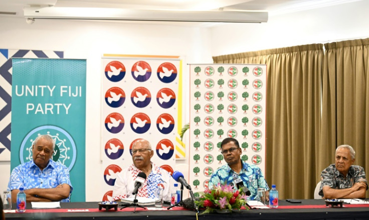 (L-R) Unity Fiji leader Savenaca Narube, People's Alliance leader Sitiveni Rabuka, National Federation Party leader Biman Prasad and former premier and leader of the Fiji Labour Party Mahendra Chaudhry attend a press conference December 17, 2022
